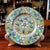 This vintage-inspired plate is crafted from ceramic, featuring a vibrant Majolica-style finish—adorned with hand-painted,...