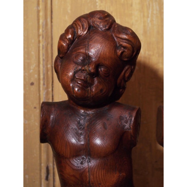 Beautifully carved wood Putti sculptures from Italy. 18th Century. Very sweet faces but no arms.
