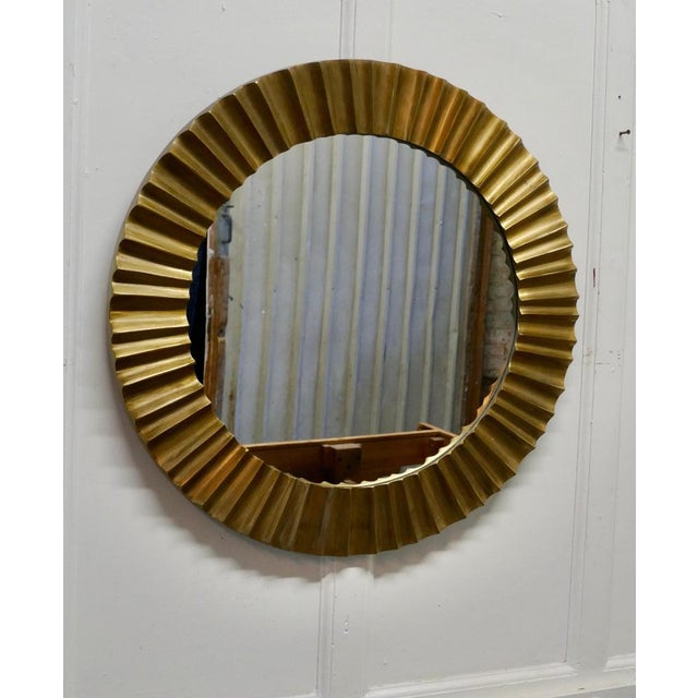 Heavy brass Art Deco odeon sunburst mirror A superb piece, made in the last century, the mirror 4” wide frame is made in...