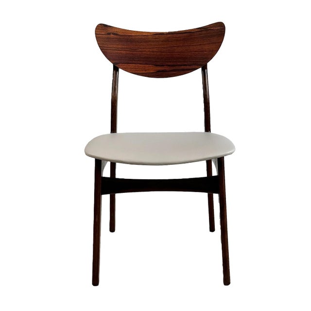 Elevate your dining experience with our Vintage Rosewood Dining Chair - Set of 4. Crafted from solid Rosewood, this Danish...