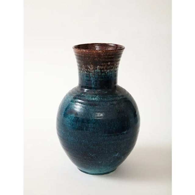 A ceramic vase in a beautiful glaze of blue and brown produced by Accolay Pottery. Founded in the 1950s in Accolay,...