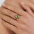 This elegant cocktail ring features 2.39ct of peridot & blue sapphire, set in 18k yellow gold. The pear-shaped center...