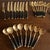 1960s Mid-Century Modern Black & Brass Flatware Set – 50 Pieces, Stainless Steel With Riveted Handles - Utensils For Sale - Image 9 of 9