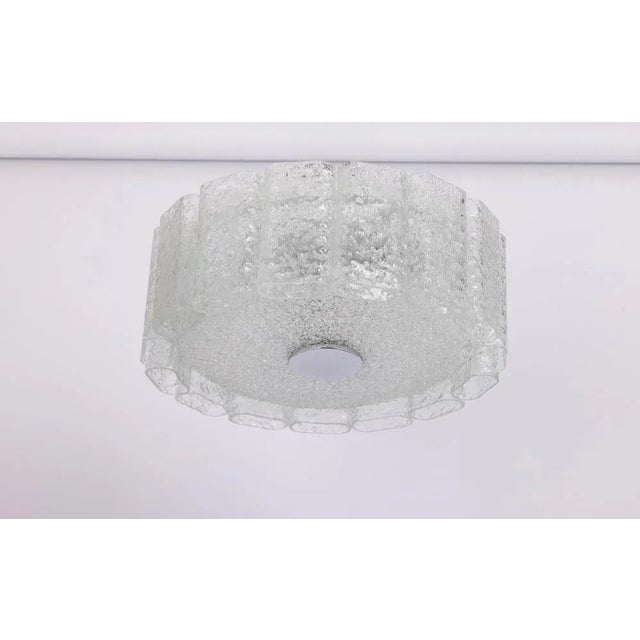 Fantastic mid-century chandelier by doria, germany, manufactured circa 1960-1969. Art glass cylinders are suspended from...