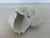 Beautiful large ceramic cast seashell sculpture. Measures 7" high, 12" across widest point, 9.5" deep.