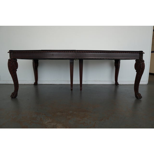 The Maitland Smith Chippendale Extension Dining Table is a beautifully crafted piece inspired by classic English...