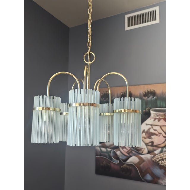 Bring iconic Italian modernism into your home with this striking vintage 5-light chandelier attributed to Gaetano...