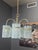 Bring iconic Italian modernism into your home with this striking vintage 5-light chandelier attributed to Gaetano...