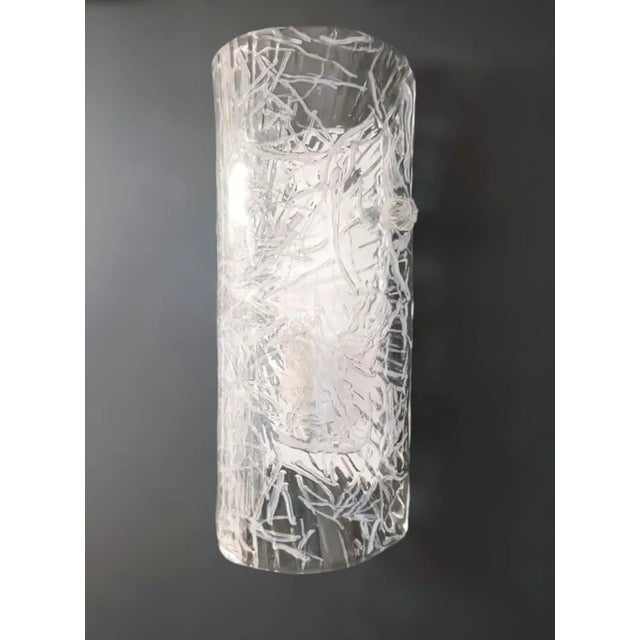 Italian wall light with a cylinder Murano glass shade in clear color with white texture, mounted on white metal frame /...