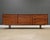 A mid century modern teak nine drawer long dresser with inset pulls and tapered legs. Made in Denmark. Circa 1960’s....