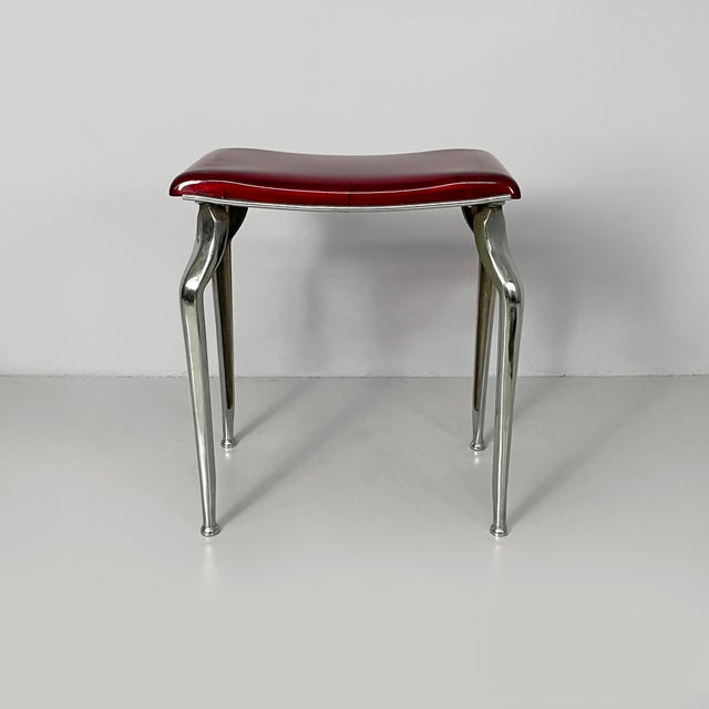 Italian Art Deco Bakelite and metal table stool, 1930s Table stool with rectangular seat in transparent red Bakelite. The...