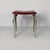 Italian Art Deco Bakelite and metal table stool, 1930s Table stool with rectangular seat in transparent red Bakelite. The...