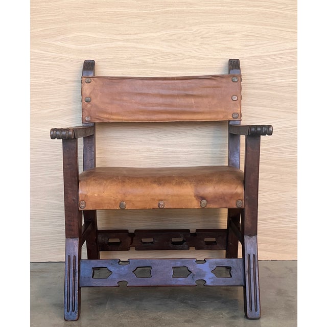 19th century walnut Spanish colonial altar armchairs with wood back with ornamental carved and wood seat. The unusual lyre...