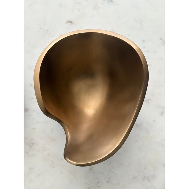 The Laguna Bowl invites the eye to examine the subtle contrasts of its shape and textures. Made of solid cast bronze, the...