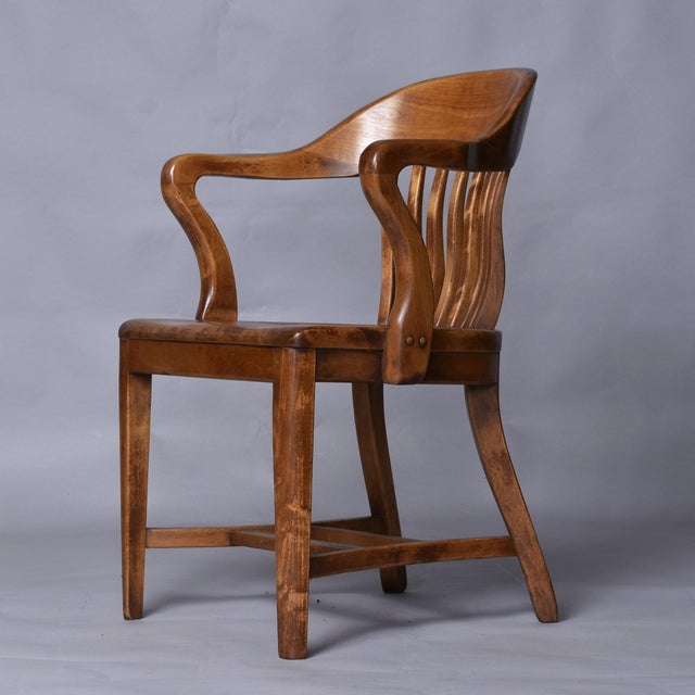 Handsome set of three solid wood chairs dating from the early 20th Century. This model is often called bankers or library...