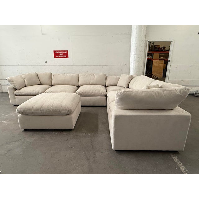 Design Plus Gallery presents the Zone Cream White Fabric Seven-Piece Modular Sectional with Ottoman from Living Spaces....