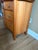 Charming vintage three-drawer bow-front dresser featuring a warm natural wood finish, gently curved drawer fronts and...