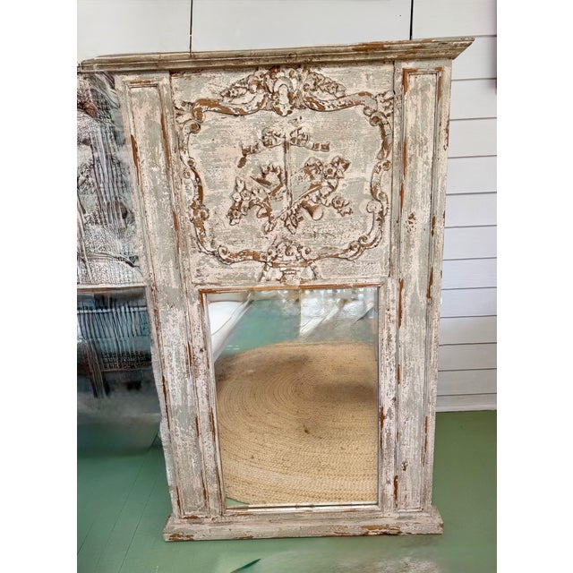 Beautifully hand carved French Trumeau mirror. Soft creamy moss color, intentionally chipped away to reveal the wood...