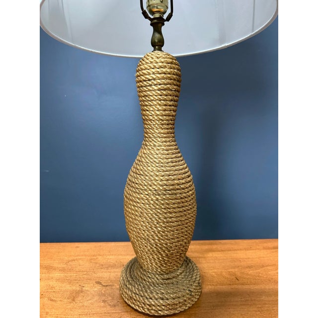 Lovely figural French rope lamp that spirals from top to bottom. Dimensions: h: 26.5" to top of finial w/d: 6" Lamp shade...
