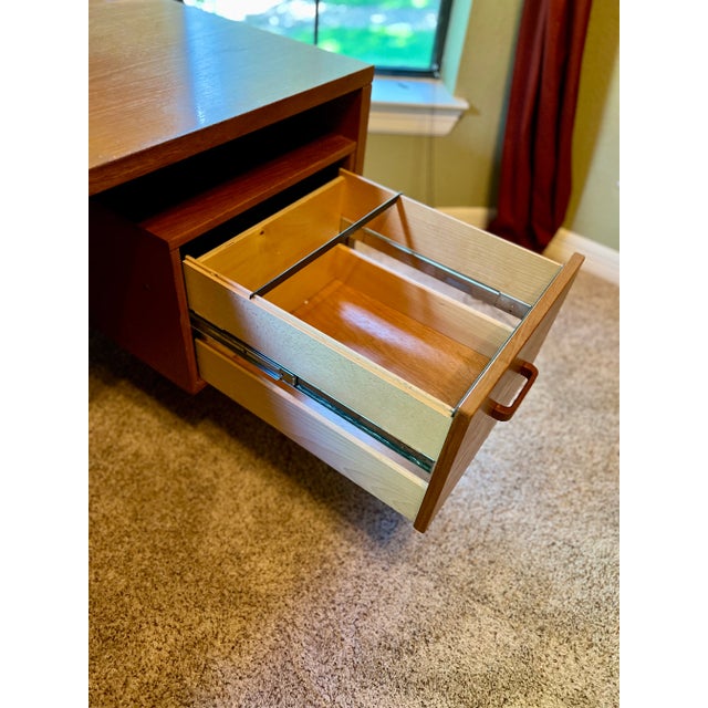 Beautiful Mid Century Modern Desk, original owner. Solid heavy teak wood. One file drawer, two additional drawers and two...