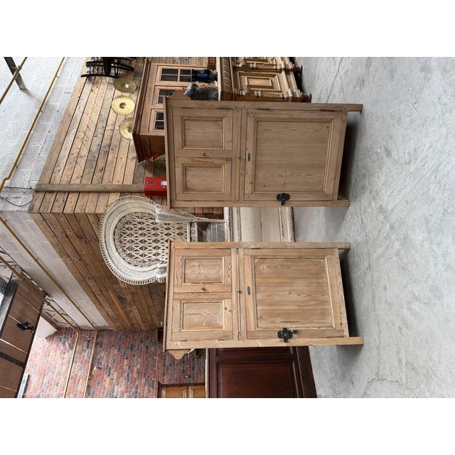 These antique boarding school cabinets, made of raw pine, have been fully restored. They each feature two upper doors...