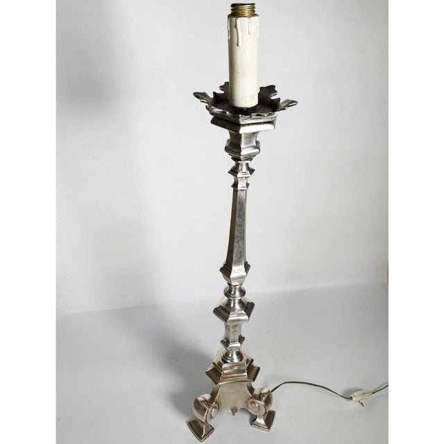 Vintage metal candelabra lamp, made in France in the 1970s. This slender light fixture takes its classic silhouette from...