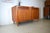 This is a Danish teak sideboard from Kollund Möbler. The sideboard embodies the design principles of Scandinavian...