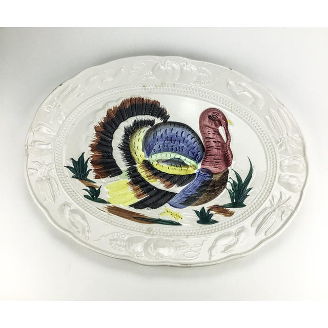A huge 19 inch ceramic platter. In wonderful vintage condition with only a small repair which doesn’t take away the...