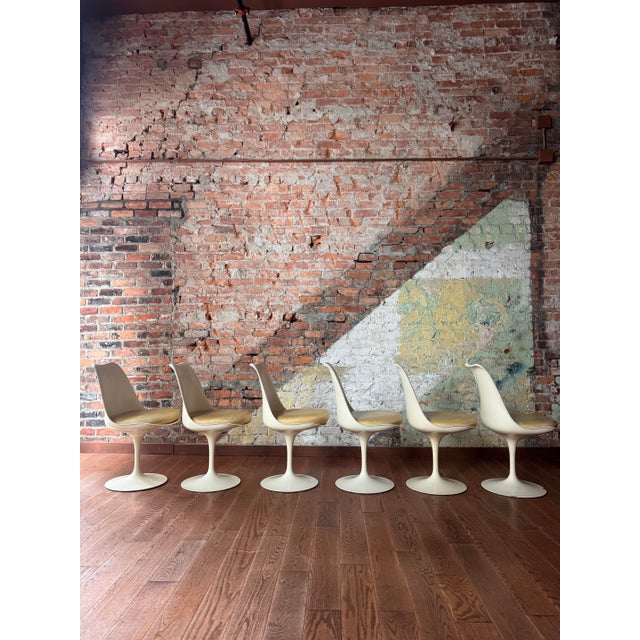 This set of six authentic Saarinen Tulip chairs represents early Knoll production, manufactured during the most sought-...