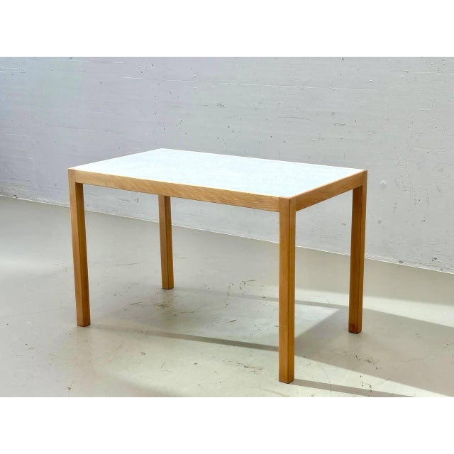Vintage dining table from the swiss furniture manufacturer horgen glarus. The design is characterized by its clean, linear...