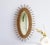 A vintage oval mirror made out of rattan and bamboo. The vintage French Riviera style mirror has a shape of a sun. Very...