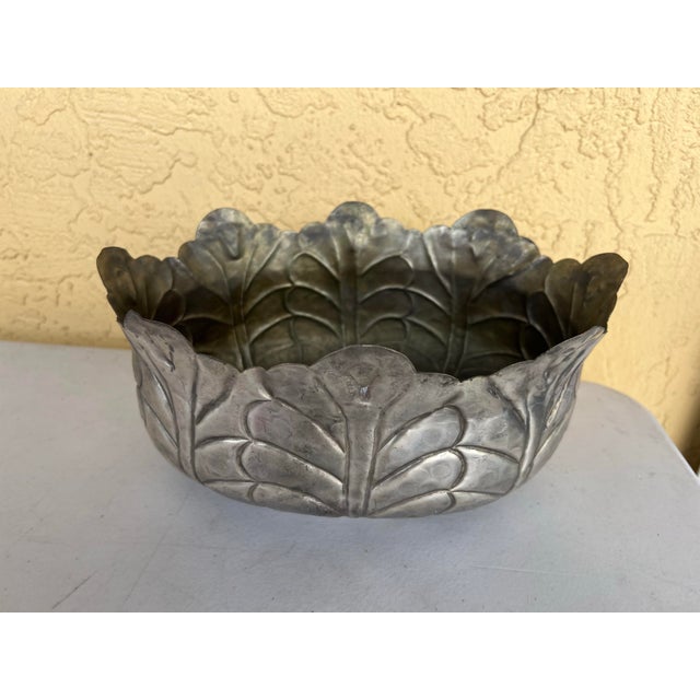 This vintage hammered silver-plated bowl is a stunning decorative piece that would enhance the beauty of any home. With...