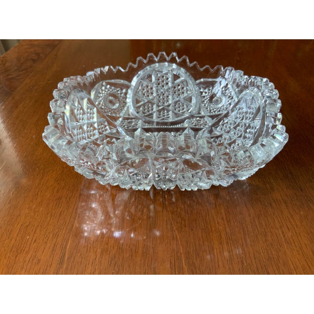 This gorgeous antique saw tooth style crystal bowl, this features an intricately hand cut pattern that sparkles in the...