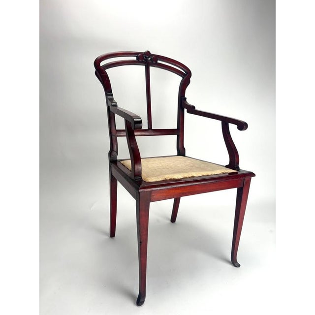 These two rare wooden armchairs by Carlo Zen are exceptional examples of early 20th-century Italian Art Nouveau design....