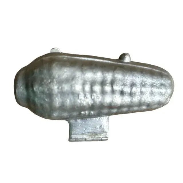 An antique pewter ice cream mold in the shape of an ear of corn, made by E & Co NY — a charming piece of culinary history....