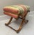 Beautiful scrolled x base ottoman bench with parsons style striped pastel down cushion top.