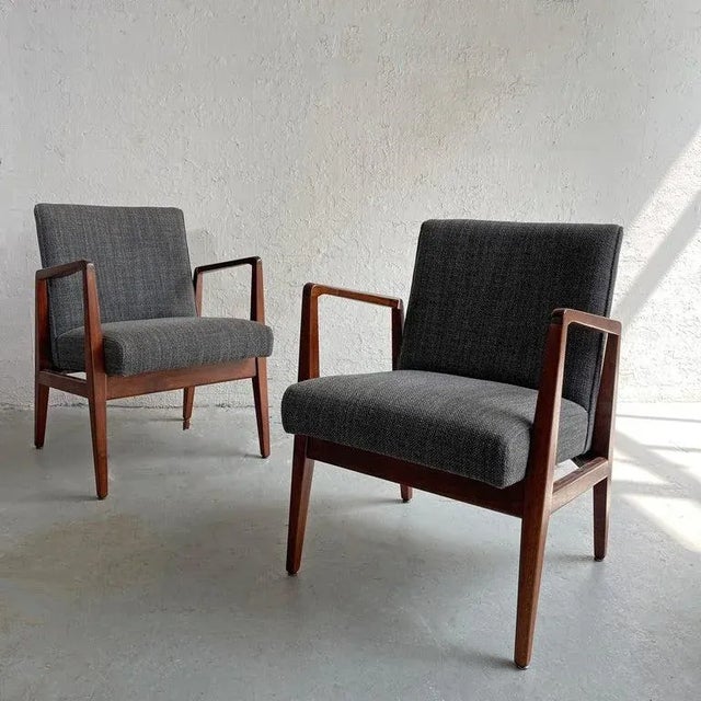 Pair of beautifully restored, model C-120 armchairs by Jens Risom feature sculptural, solid walnut frames with textured,...