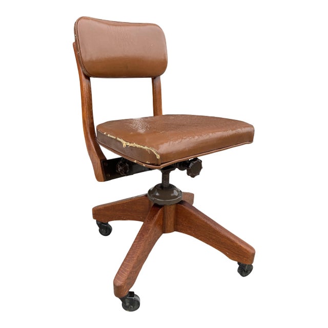Gunlocke style antique swivel-tilt desk chair solid oak frame with brass trim. This chair was salvaged from the old main...