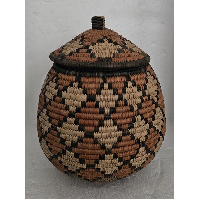 A beautiful handcrafted traditional Zulu basket from KwaZulu, South Africa. Expertly woven using traditional techniques...