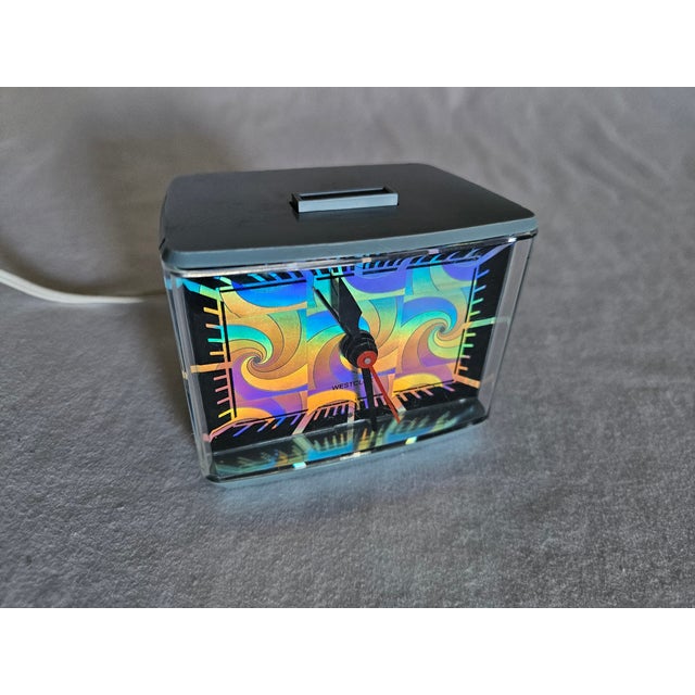 A Colorful Westclox Psychedelic Holographic Electric Alarm Clock with shut off button. features moving Holographic Paisley...