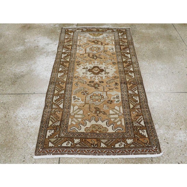 This Mid-20th century Persian Malayer rug, measuring 3' 2" x 5' 10", displays the distinctive tribal artistry for which...
