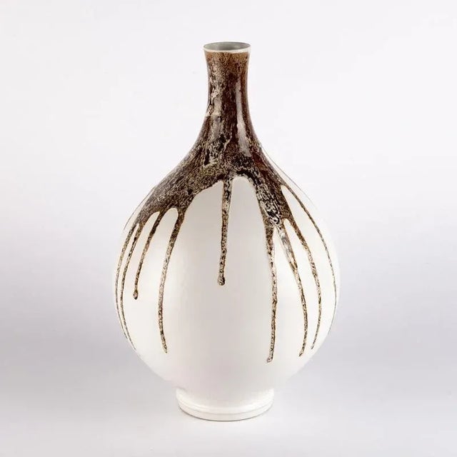 A ceramic vase made by the Czech company Ditmar Urbach that was established by Rudolf Ditmar in Znojmo in 1878 and later...