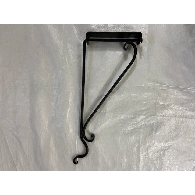 Vintage black wrought iron adjustable wall hook. Backplate can be fixed to wall, hook can swing 180 degrees. Perfect for...