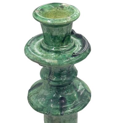 A Moroccan Tamegroute glazed candlestick holder is a handcrafted piece made in the historic pottery village of Tamegroute...