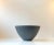Vintage white enameled steel and dark grey Eternit (asbestos-free) Krenit bowl. Designed by Herbert Krenchel and...