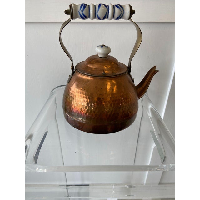 Antique Dutch copper plated teapot with hammered styling. Patina around base. Dimensions 6.75"L x 8.25"W x 8.75"H