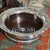 Antique English SilverPlate magnum wine coaster featuring an ornate grapevine repoussé rim. Built with a heavy,...