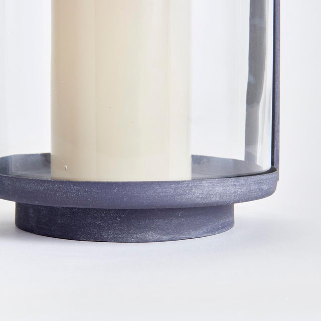 With a finish reminiscent of an aged European zinc, this simple and streamlined outdoor hurricane is made to maintain the...