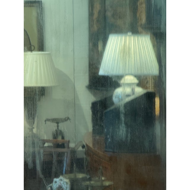 A simple, well-proportioned giltwood mirror with a molded frame showing good patina to the gilt surface. The original...