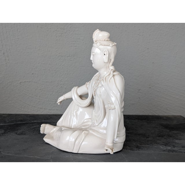 Fine porcelain Guan Yin figurine in excellent condition. This vintage 70's Blanc de Chine-styled and numbered figurine is...